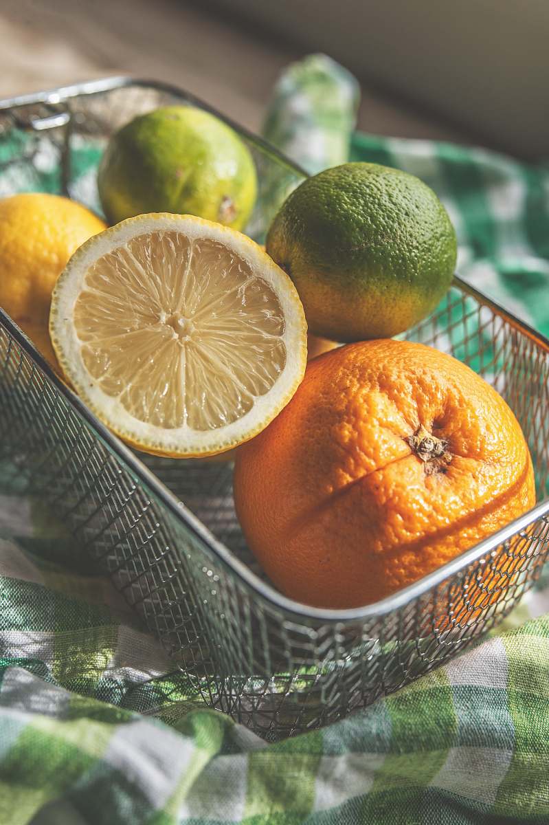 citrus fruit lemons and oranges in basket fruit